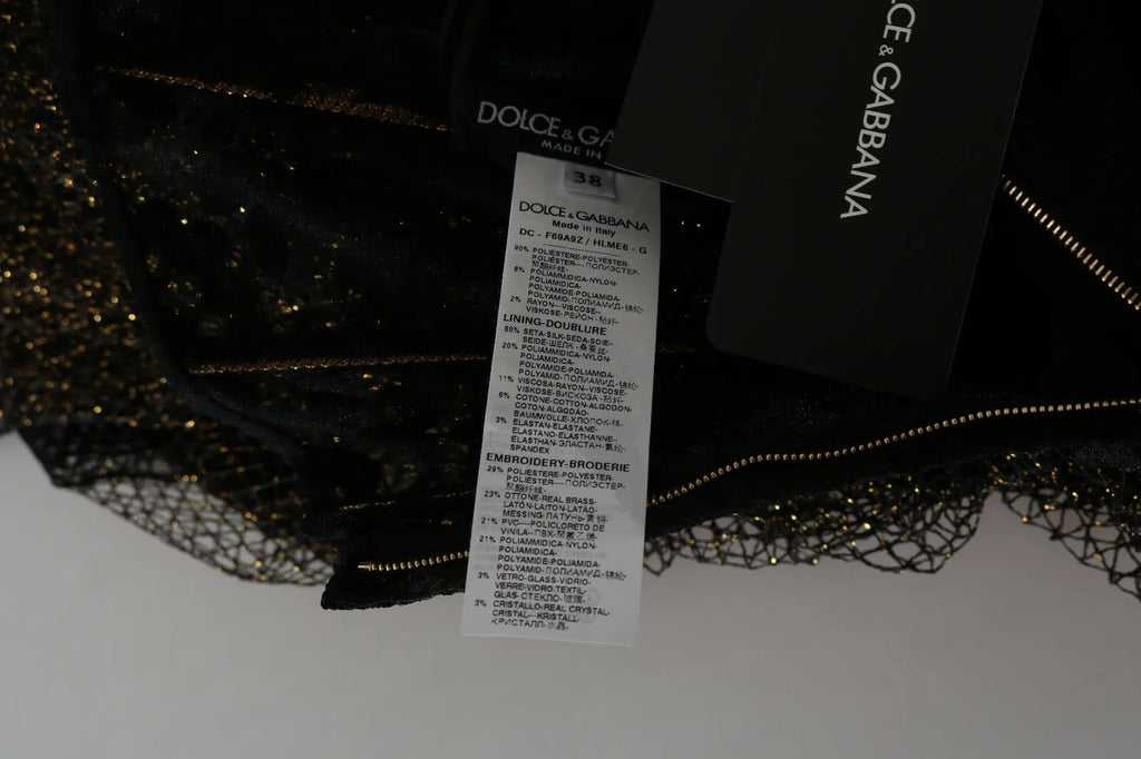 Robe en ligne Dolce & Gabbana noire et or avec cœur en cristal, coupe évasée et élégante.