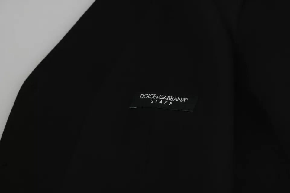 Gilet formel en laine noire de la marque Dolce & Gabbana, coupe ajustée et ceinture stretch, porté sur un fond neutre.