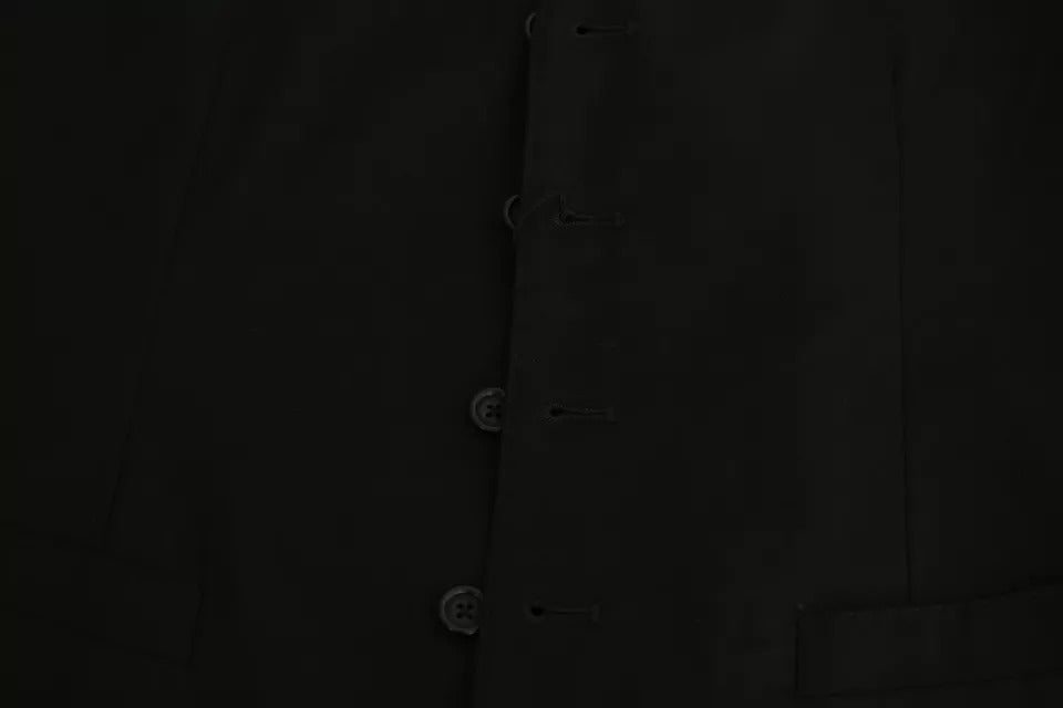 Gilet en laine noire stretch Dolce & Gabbana, vêtement formel pour homme, détail élégant et ajusté.