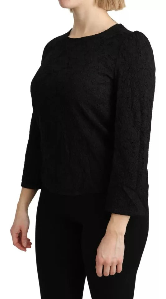 Blouse noire en dentelle à manches longues de Dolce & Gabbana, style élégant et féminin, vue de face.