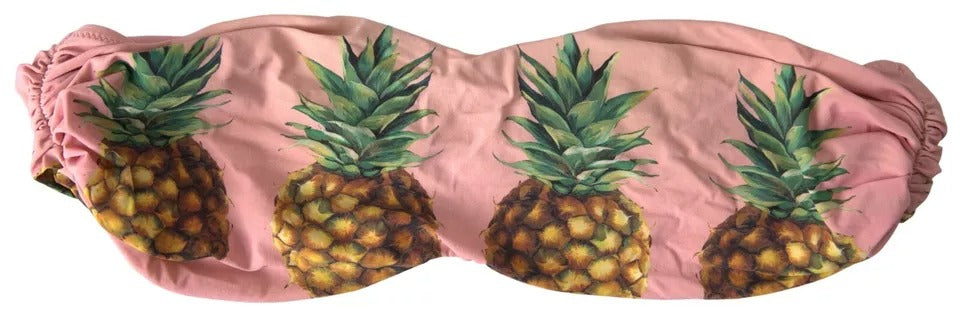Top de bikini Dolce & Gabbana rose imprimé pour plage, avec détails colorés et style élégant.