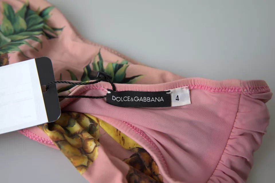 Top de bikini imprimé rose Dolce & Gabbana pour plage, maillot de bain élégant avec motifs colorés.