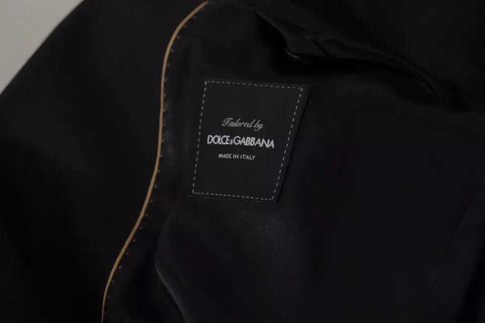 Veste blazer noire en polyester Dolce & Gabbana, à double boutonnage, style élégant et moderne, vue de face sur fond blanc.
