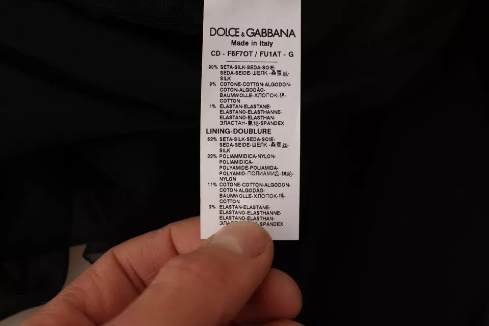 Robe courte noire à col en V et manches longues de Dolce & Gabbana, style mini A-line, élégante et sophistiquée.