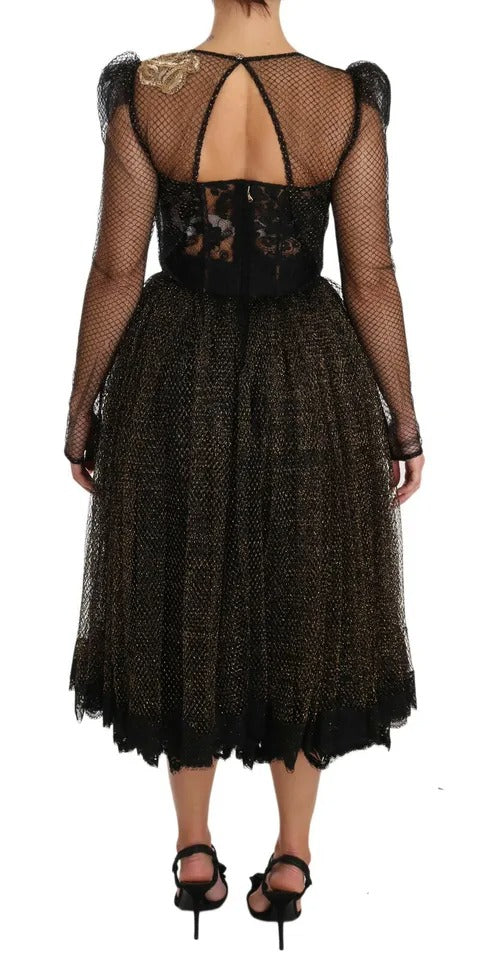 Robe en ligne A noire Dolce & Gabbana avec cristaux dorés et cœur or, élégante et ornée de détails scintillants.