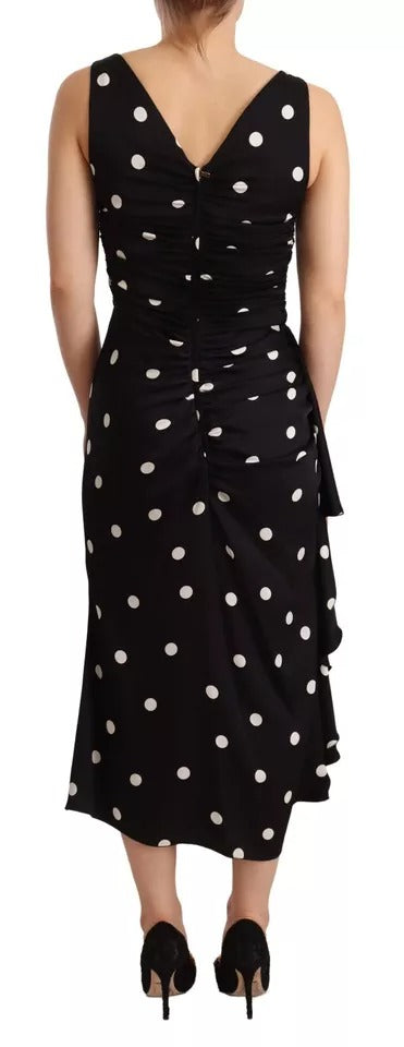 Robe midi en soie noire à pois Dolce & Gabbana, robe serre-vue avec décolleté en V, élégante et sophistiquée.