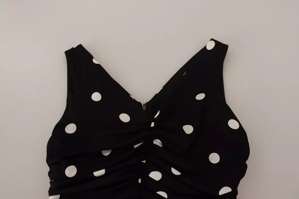Robe midi noire en soie à pois Dolce & Gabbana avec col en V, coupe ajustée et élégante pour femme.