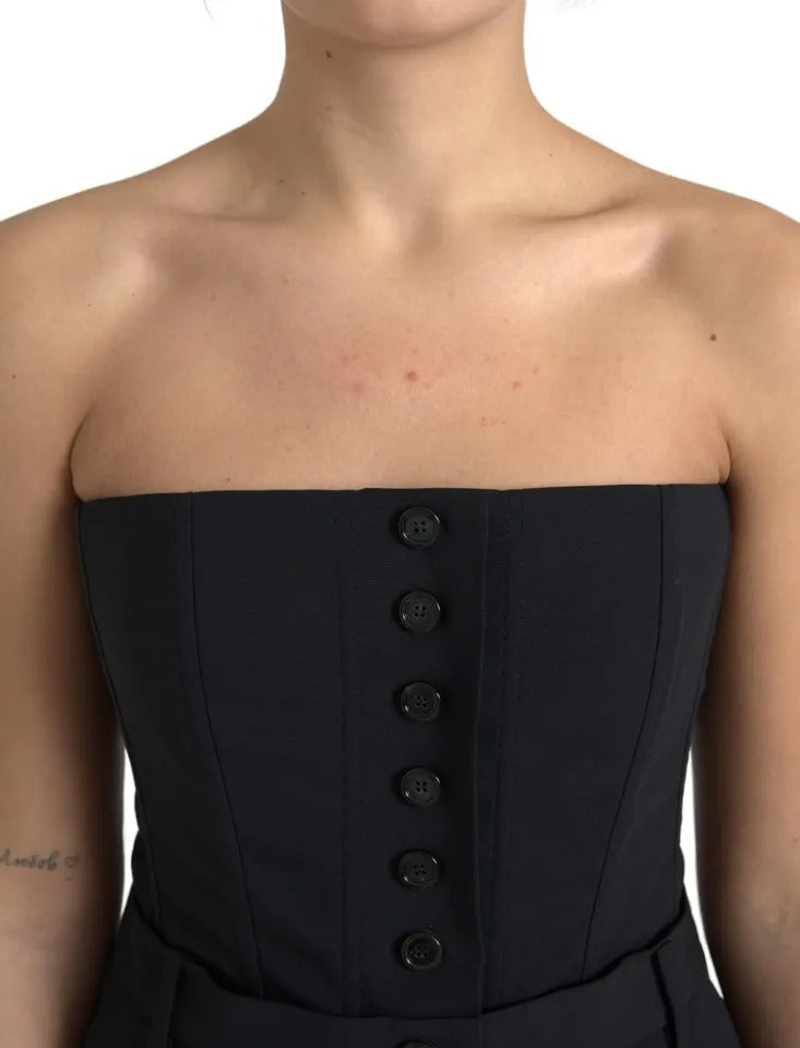 Combinaison noire en laine extensible sans bretelles de Dolce & Gabbana, élégante et ajustée, portée sur un fond neutre.