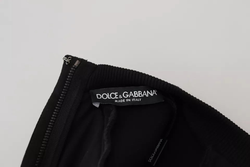 Robe courte en coton noire Dolce & Gabbana à manches longues et coupe évasée, élégante et moderne.