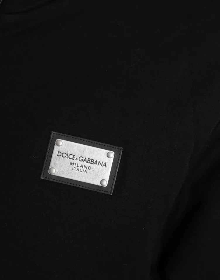 Veste bomber noire en coton Dolce & Gabbana avec capuche et logo, détails visibles sur l'image.