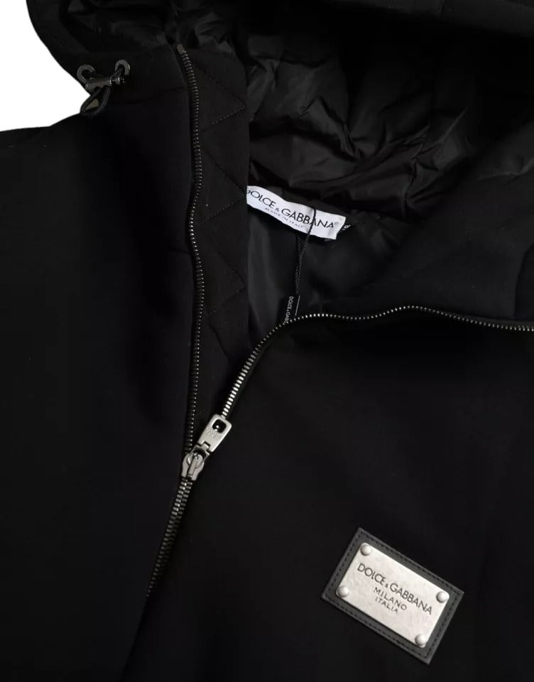 Veste bomber noire en coton Dolce & Gabbana avec capuche et logo, vue de face sur fond blanc.