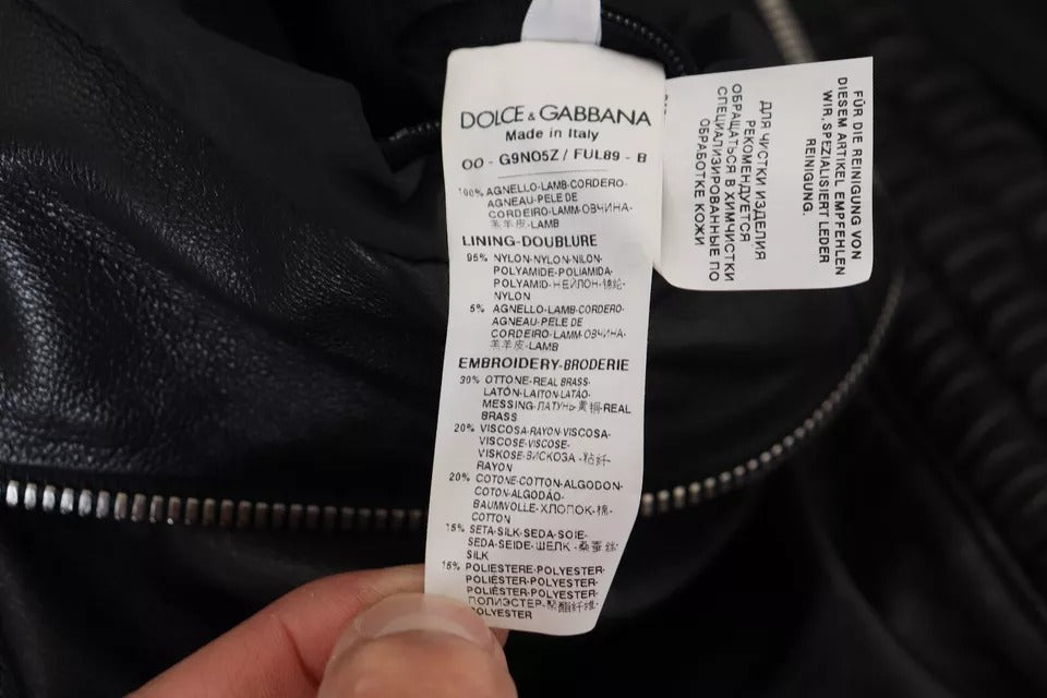 Veste en cuir noir Dolce & Gabbana avec capuche, coupe élégante et détails modernes, vue de face sur fond blanc.