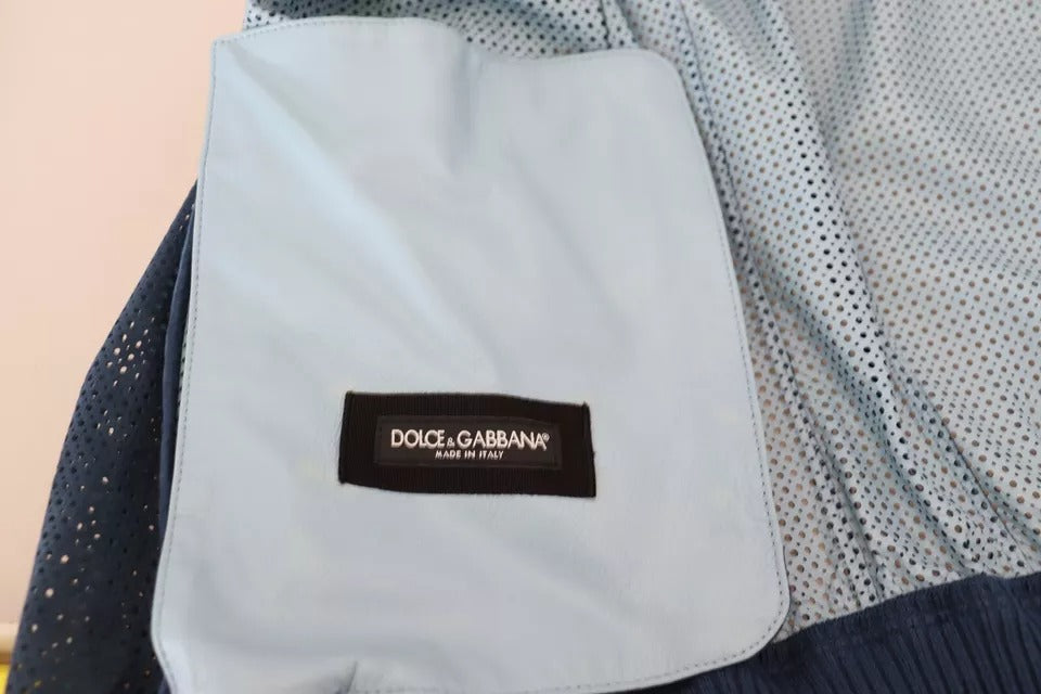 Veste en cuir bleu perforé Dolce & Gabbana avec fermeture éclair intégrale, style moderne et élégant.