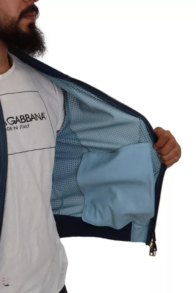 Veste en cuir perforé bleu Dolce & Gabbana avec fermeture éclair complète, vue de face.