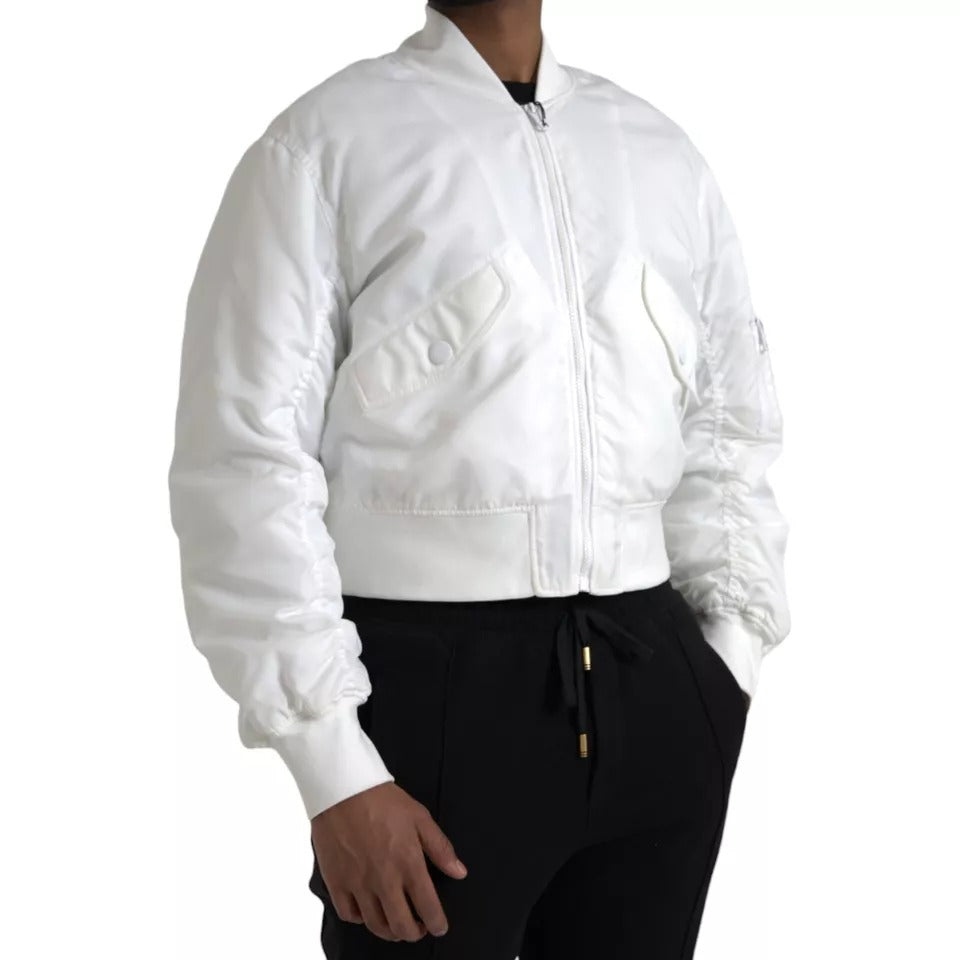 Veste bomber blanche Dolce & Gabbana à manches longues et fermeture éclair complète, élégante et moderne.