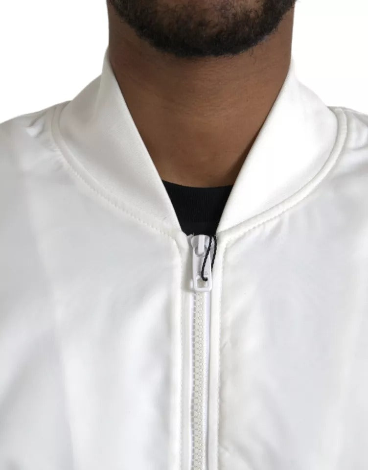 Veste bomber blanche Dolce & Gabbana à manches longues avec fermeture éclair complète, style élégant et moderne.