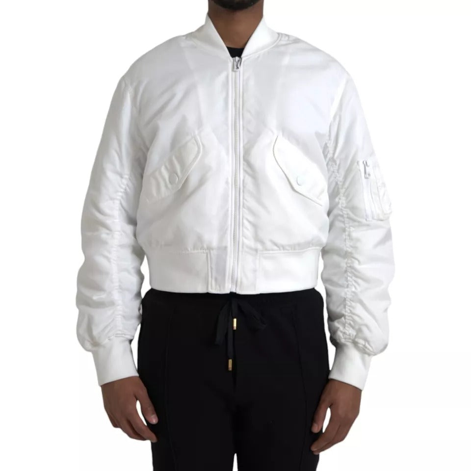 Veste bomber blanche Dolce & Gabbana à manches longues avec fermeture éclair complète, style élégant et moderne.