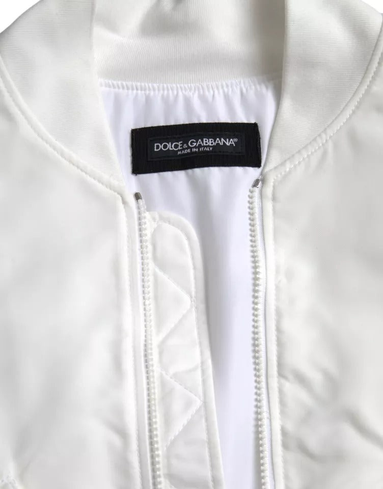 Veste bomber blanche Dolce & Gabbana à manches longues et fermeture éclair complète, élégante et moderne.