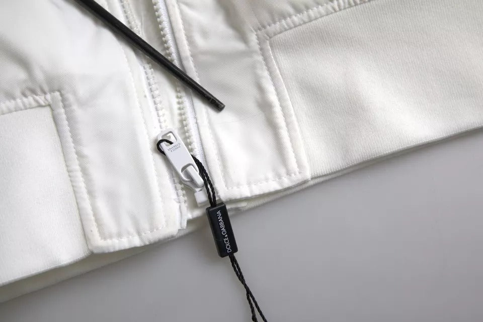 Veste bomber blanche Dolce & Gabbana à manches longues avec fermeture éclair complète, style élégant et moderne.