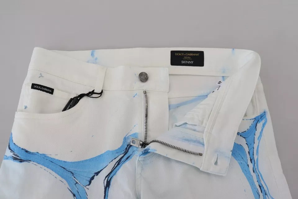 Jeans skinny en coton blanc et bleu de Dolce & Gabbana, denim ajusté avec détails modernes, vue de face.