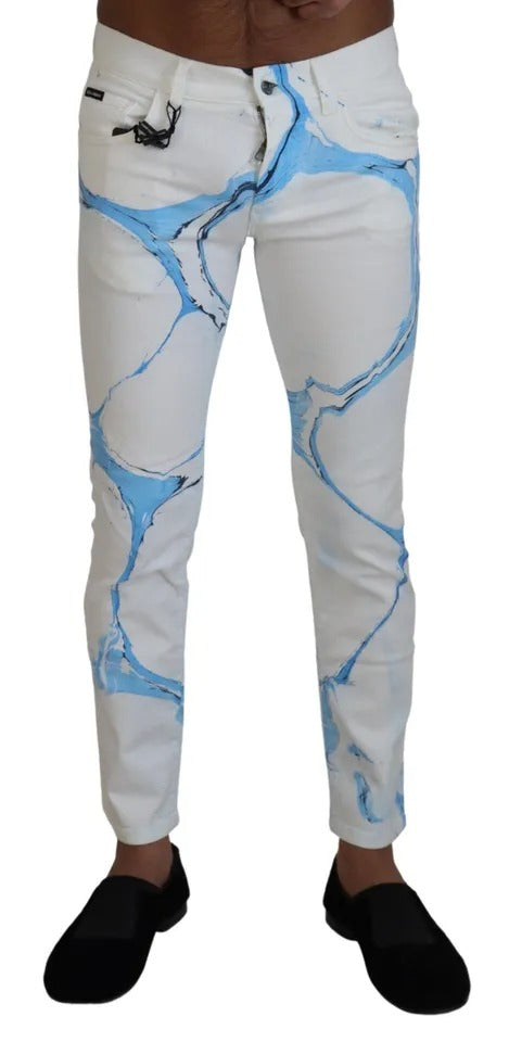 Jeans skinny en coton blanc et bleu de Dolce & Gabbana, denim ajusté avec détails modernes, vue de face.