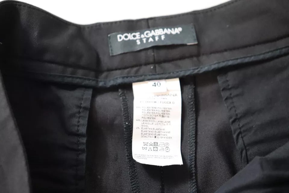 Pantalons noirs à taille haute et coupe tapered de Dolce & Gabbana, vue sur le devant avec détails élégants.