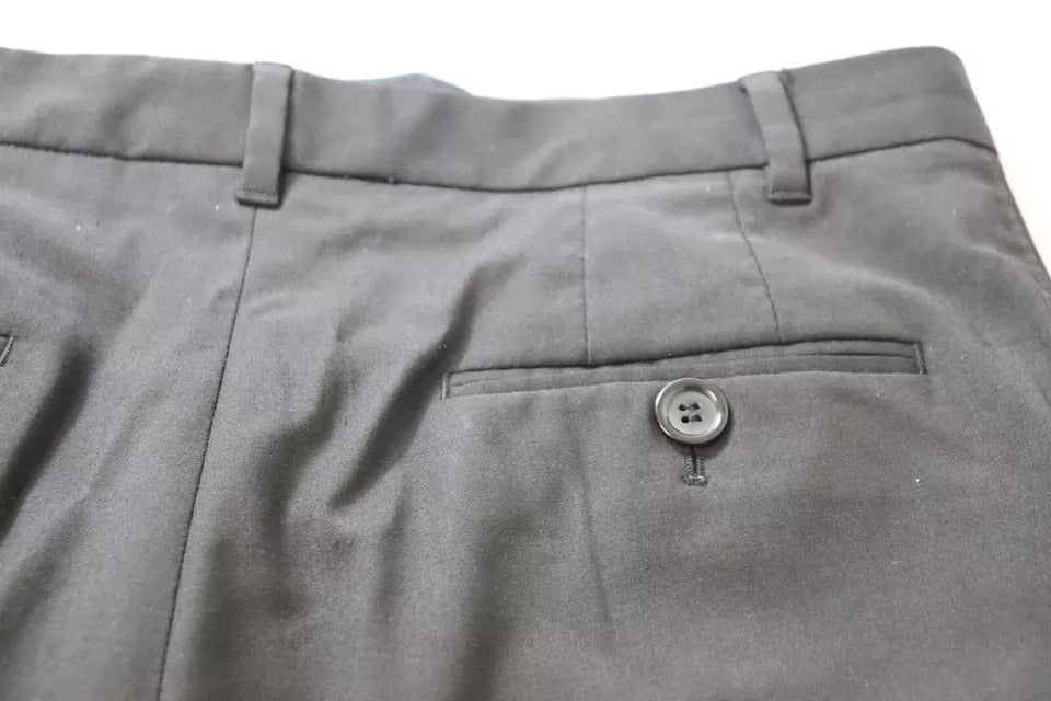 Pantalon noir taille haute fuselé Dolce & Gabbana, coupe élégante et moderne, en tissu fluide, visible en gros plan.
