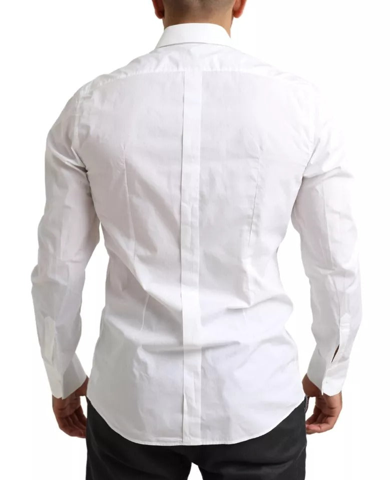 Chemise de smoking formelle blanche en coton Dolce & Gabbana avec détails dorés, vue de face.