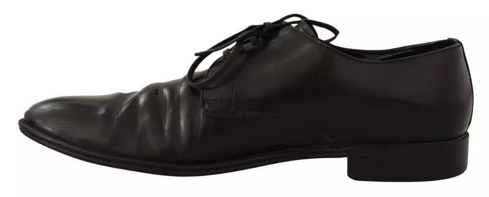 Chaussures derby formelles en cuir noir de Dolce & Gabbana, élégantes et sophistiquées pour homme.