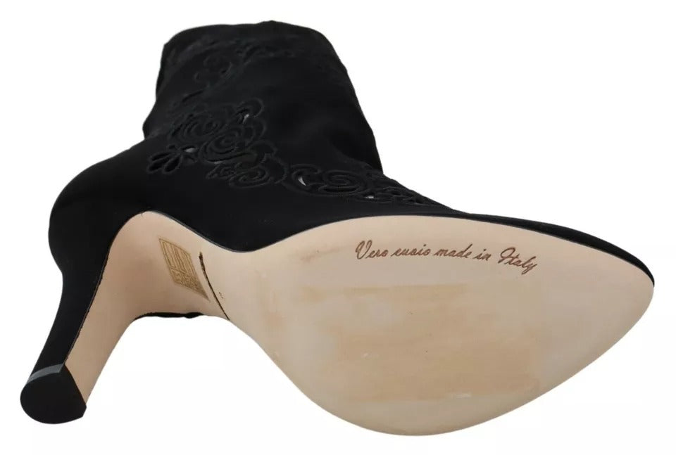 Chaussures Dolce & Gabbana, bottines noires en stretch avec fleurs en dentelle, style élégant et sophistiqué.