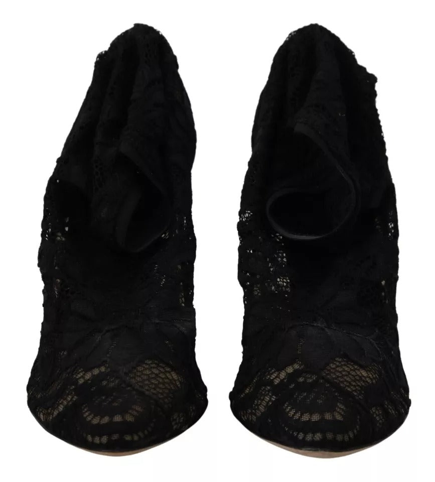 Chaussettes extensibles noires Dolce & Gabbana avec dentelle Taormina, portées avec des bottines en cuir élégantes.