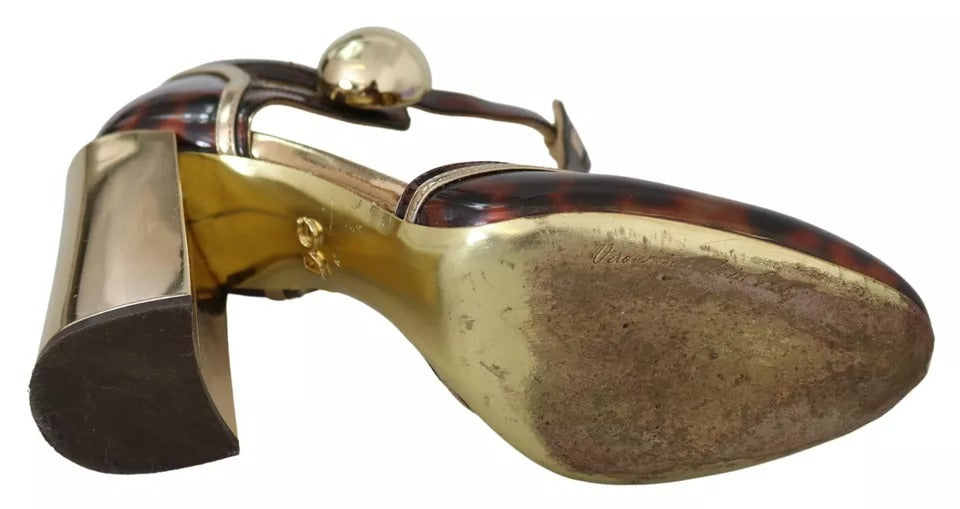 Chaussures Dolce & Gabbana talons T en or avec motif léopard, sandales élégantes à bride à la cheville.