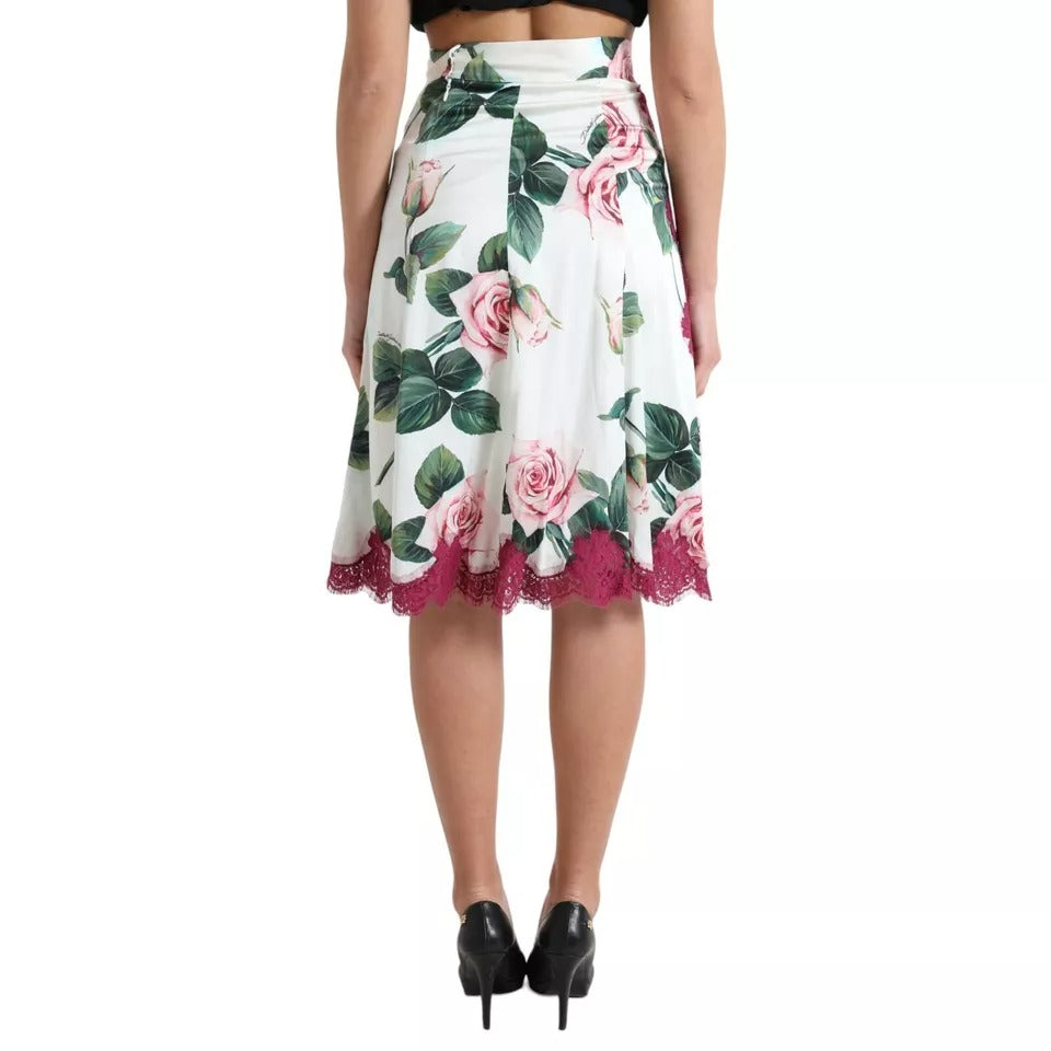 Jupe midi à taille haute Dolce & Gabbana avec imprimé de roses blanches, coupe évasée en tissu léger.