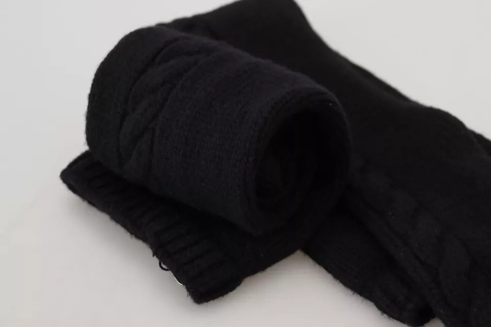 Chaussettes longues en laine noire pour femmes de Dolce & Gabbana, accessoire élégant et confortable, portée jusqu'aux mollets.