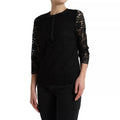 Blouse Dolce & Gabbana en dentelle florale noire, style décontracté avec col rond et manches courtes.