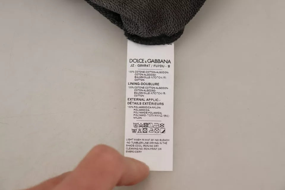 Sweat à capuche noir en coton Dolce & Gabbana avec logo, pull décontracté et élégant, porté sur un mannequin.