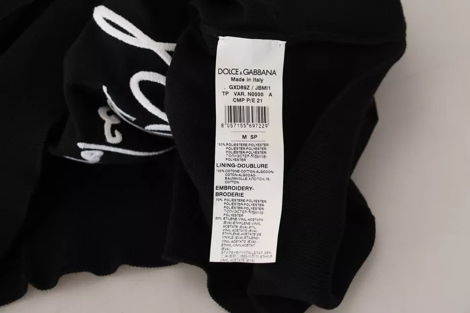 Pull à col rond en polyester noir Dolce & Gabbana pour homme, vue de face, détails du tissu et design simple.