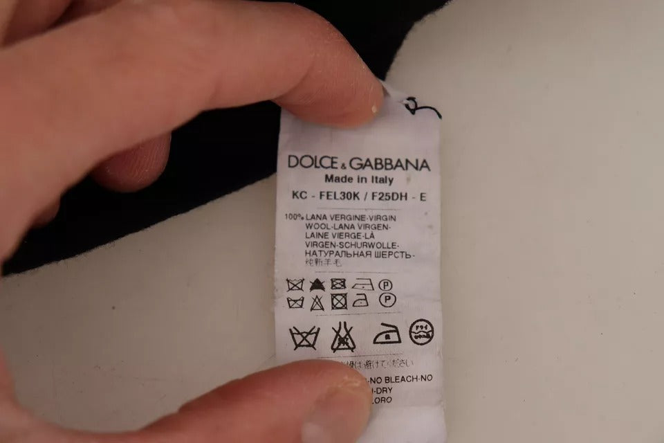 Pull en laine noir Dolce & Gabbana avec boutons, cardigan à manches longues et style classique, porté sur un mannequin.