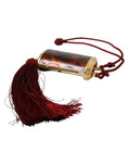 Pochette à maquillage Dolce & Gabbana en cuir marron avec motif léopard, miroir mini et tassels élégants.