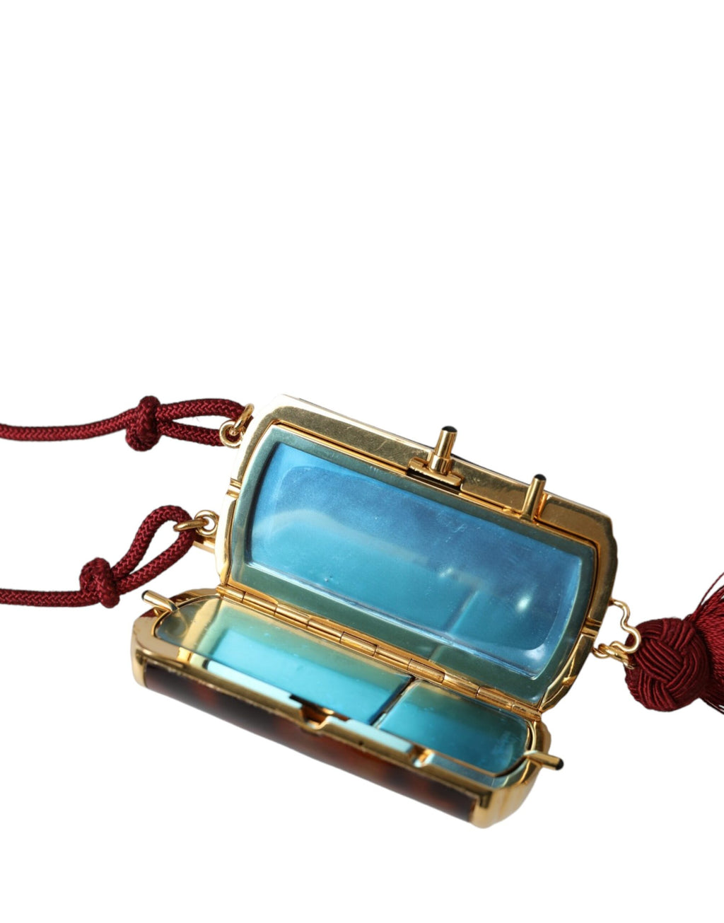 Pochette de maquillage Dolce & Gabbana en cuir marron avec motif léopard, miroir mini et pendentifs en tassel.