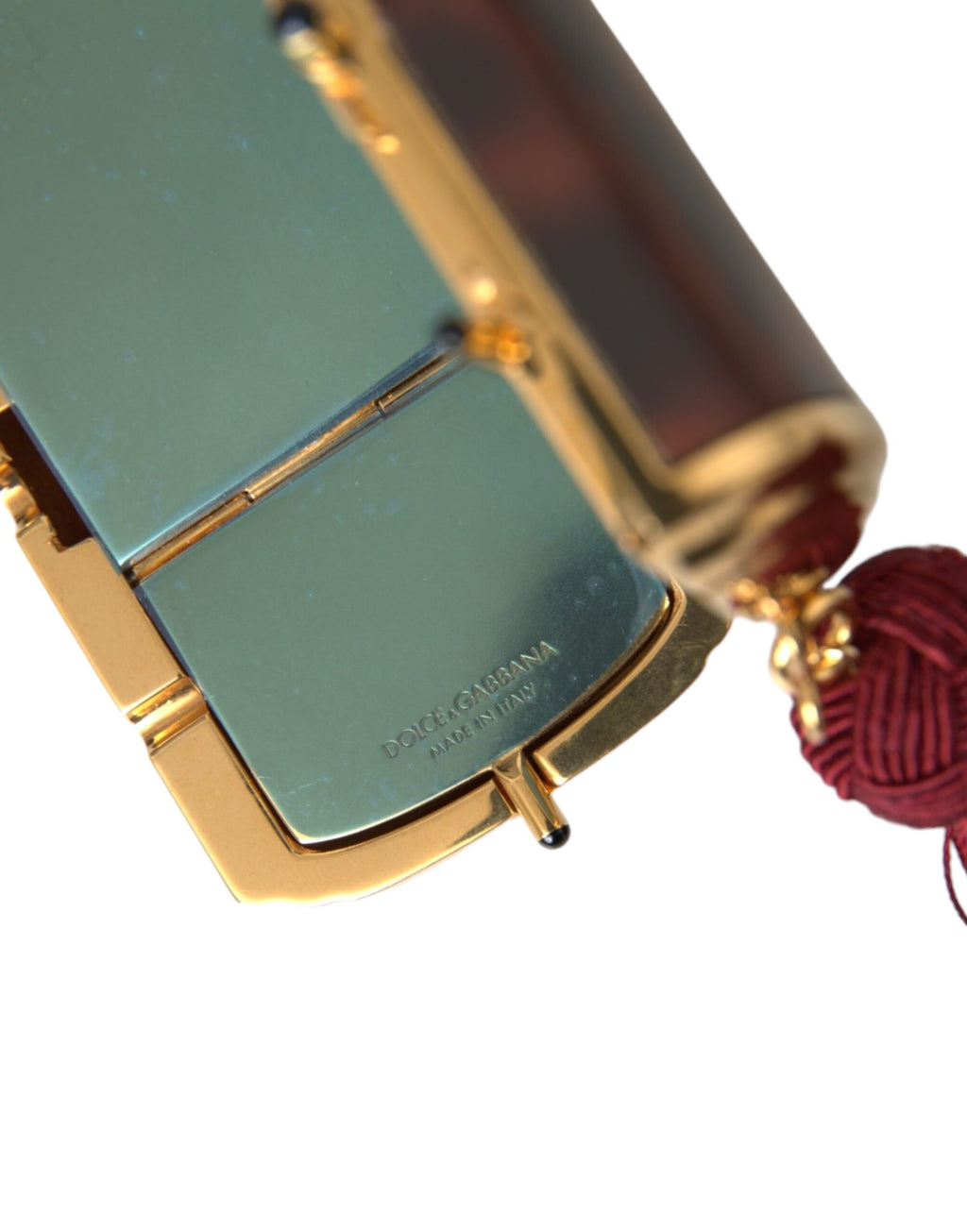Sac à maquillage Dolce & Gabbana marron avec motif léopard, miroir miniature et pompons en tassel.