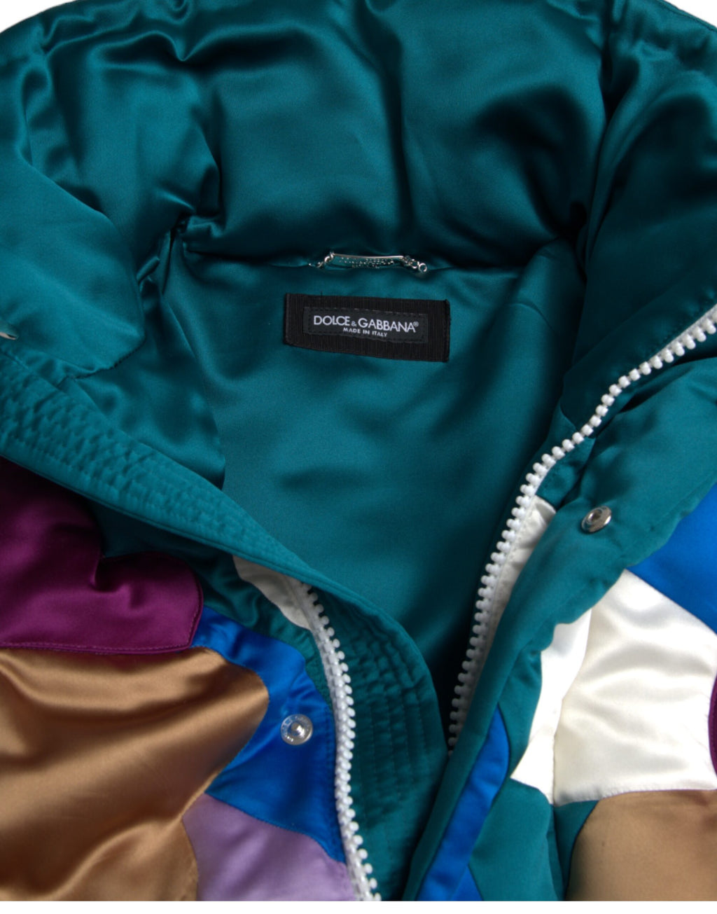 Veste coupe-vent puffer Dolce & Gabbana à fleurs multicolores avec design floral et rembourrage pour femme.