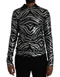 Pull en polyester noir et argenté Dolce & Gabbana avec sequins, style élégant et brillant, porté comme vêtement de mode.