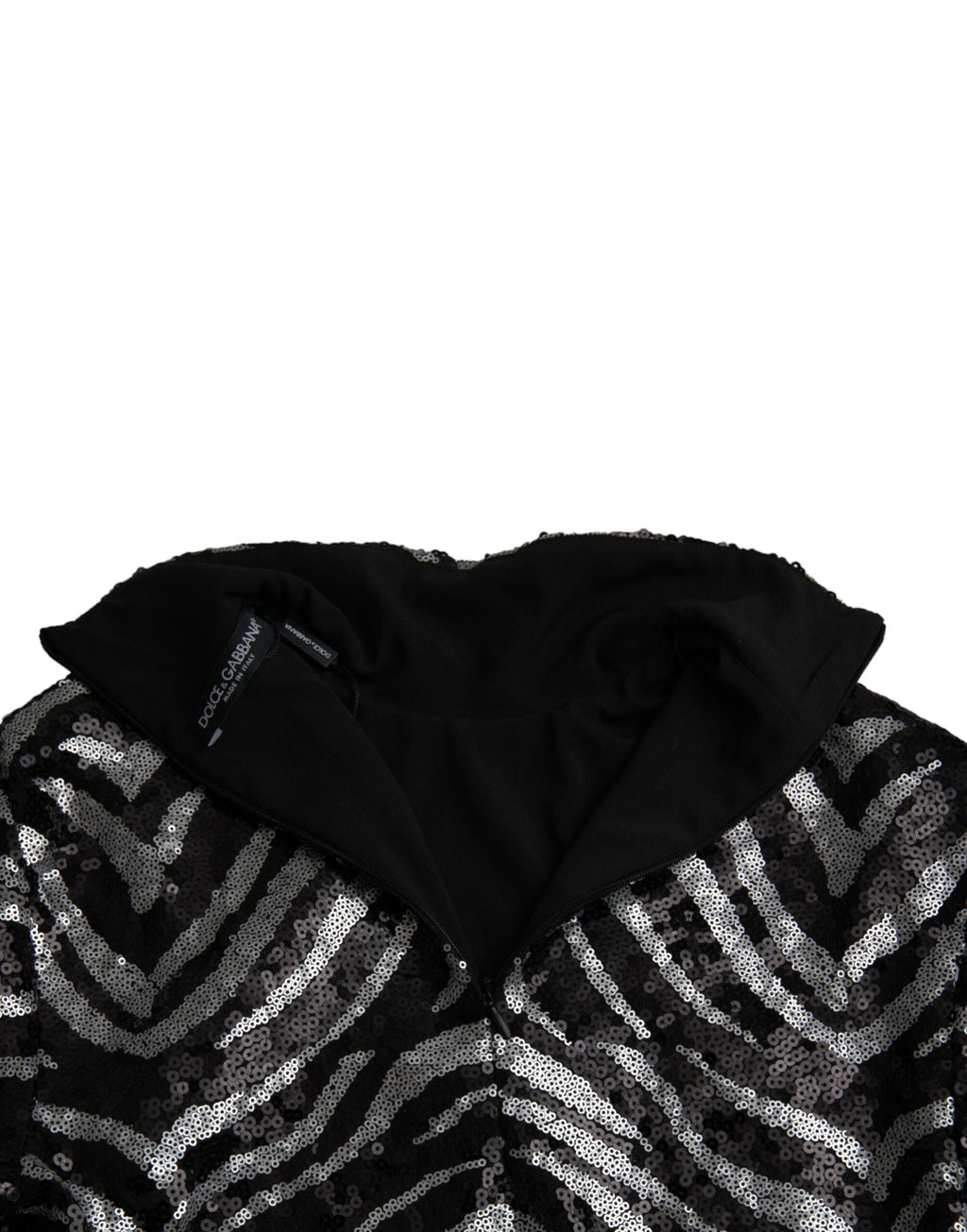 Pull en polyester noir et argenté Dolce & Gabbana avec sequins, style élégant et brillant, porté sur un mannequin.