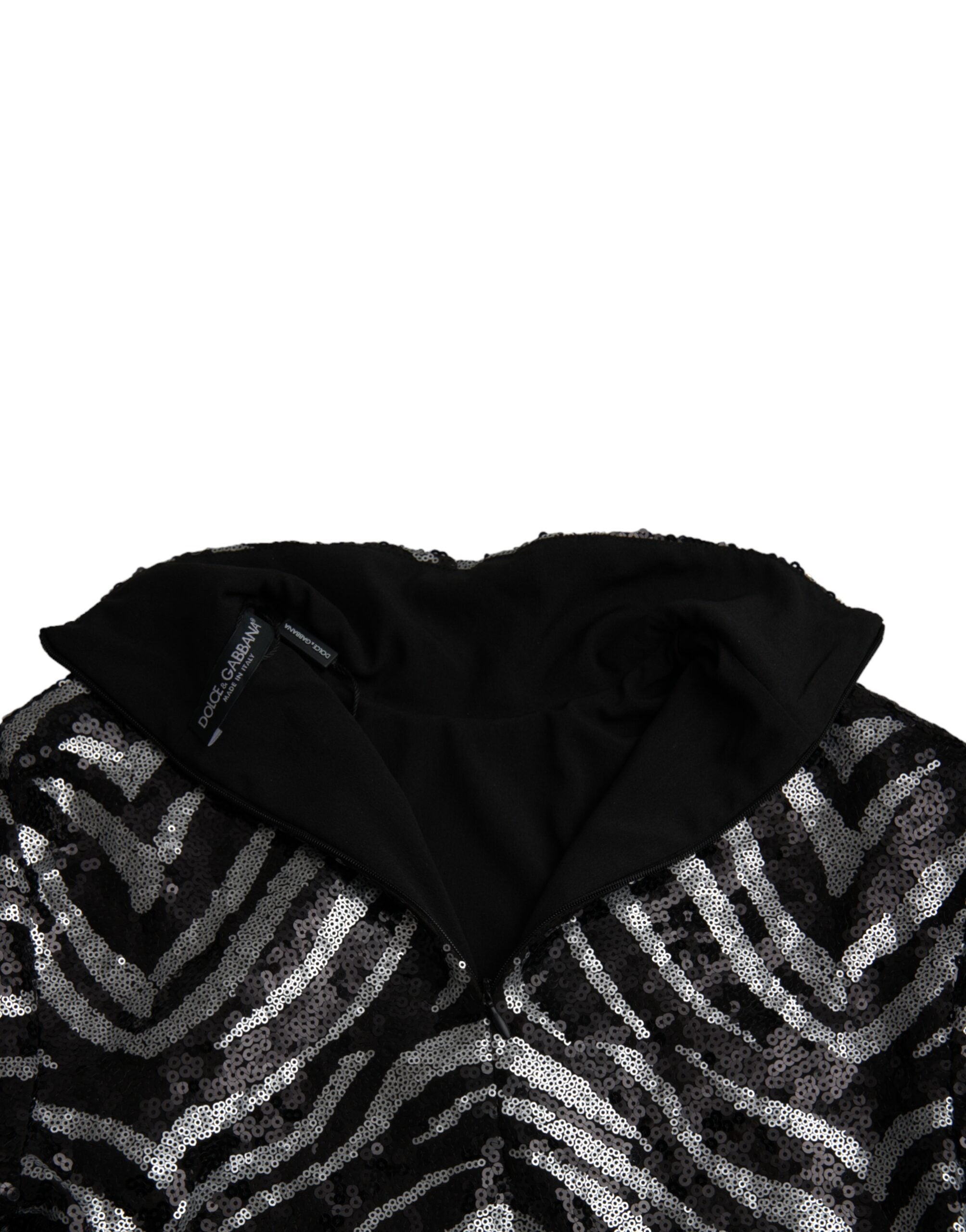 Pull en polyester noir et argenté Dolce & Gabbana avec sequins, style élégant et brillant, porté sur un mannequin.