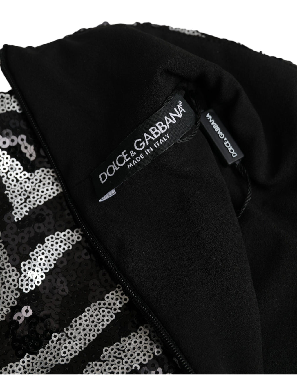 Pull en polyester noir et argenté à sequins Dolce & Gabbana, élégant et brillant, pour un style sophistiqué.