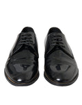 Chaussures Derby en cuir verni noir Dolce & Gabbana, chaussures formelles élégantes pour homme, vue en gros plan.
