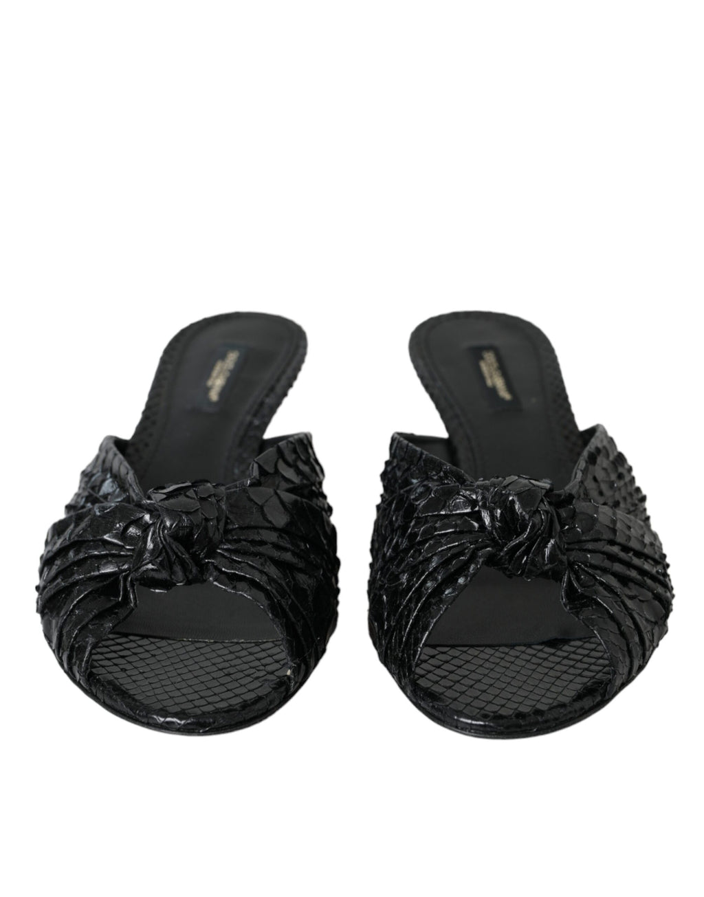 Escarpins Dolce & Gabbana en cuir exotique noir, chaussures à talons et slides élégants visibles sur l'image.