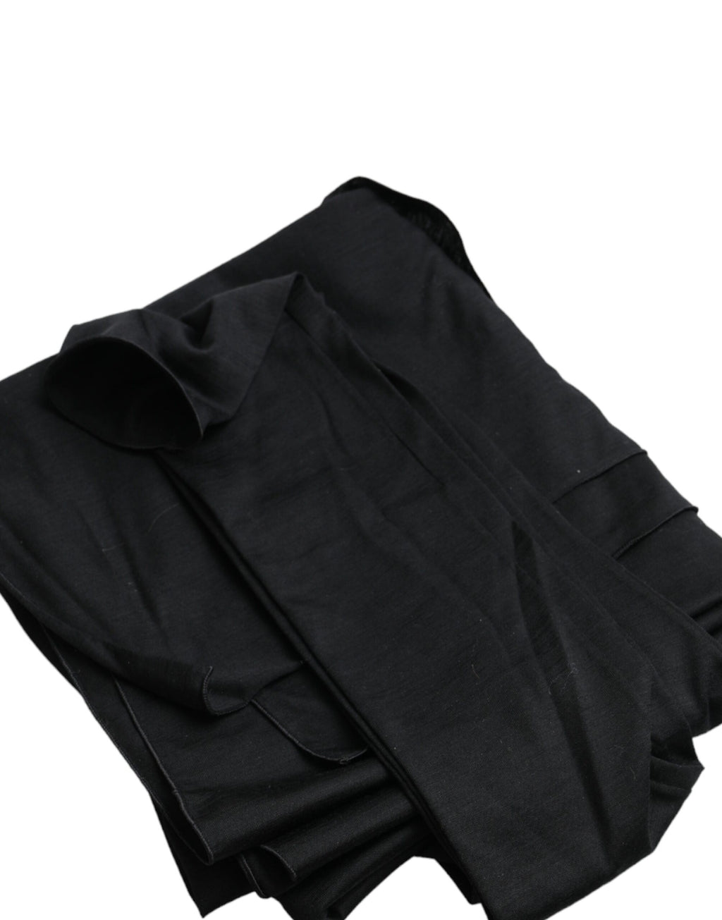Haut noir en laine Dolce & Gabbana, coupe asymétrique avec découpes et manches longues, style élégant et moderne.