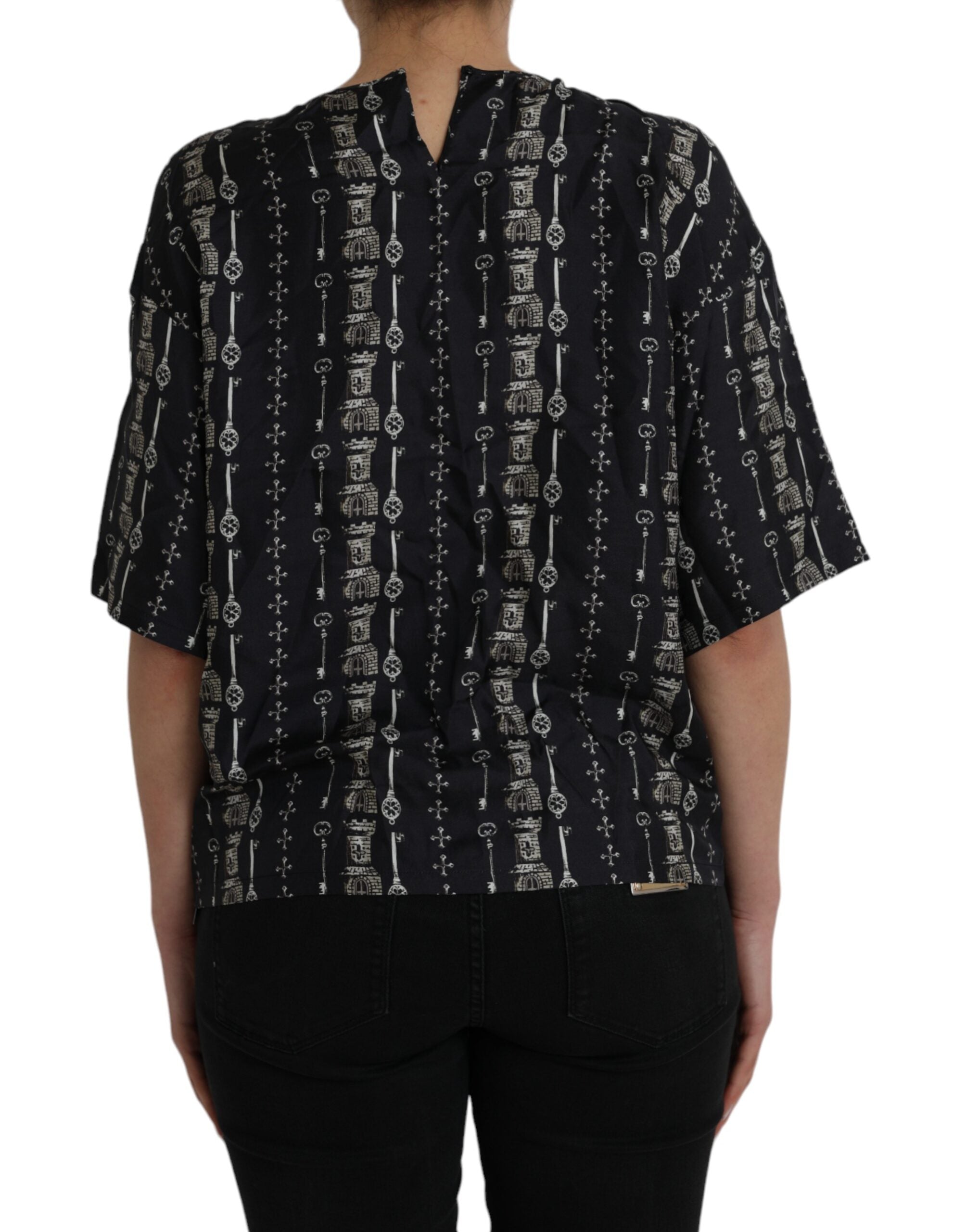 Chemise en soie noire Dolce & Gabbana avec motif clé et château, élégante blouse à imprimé sophistiqué.